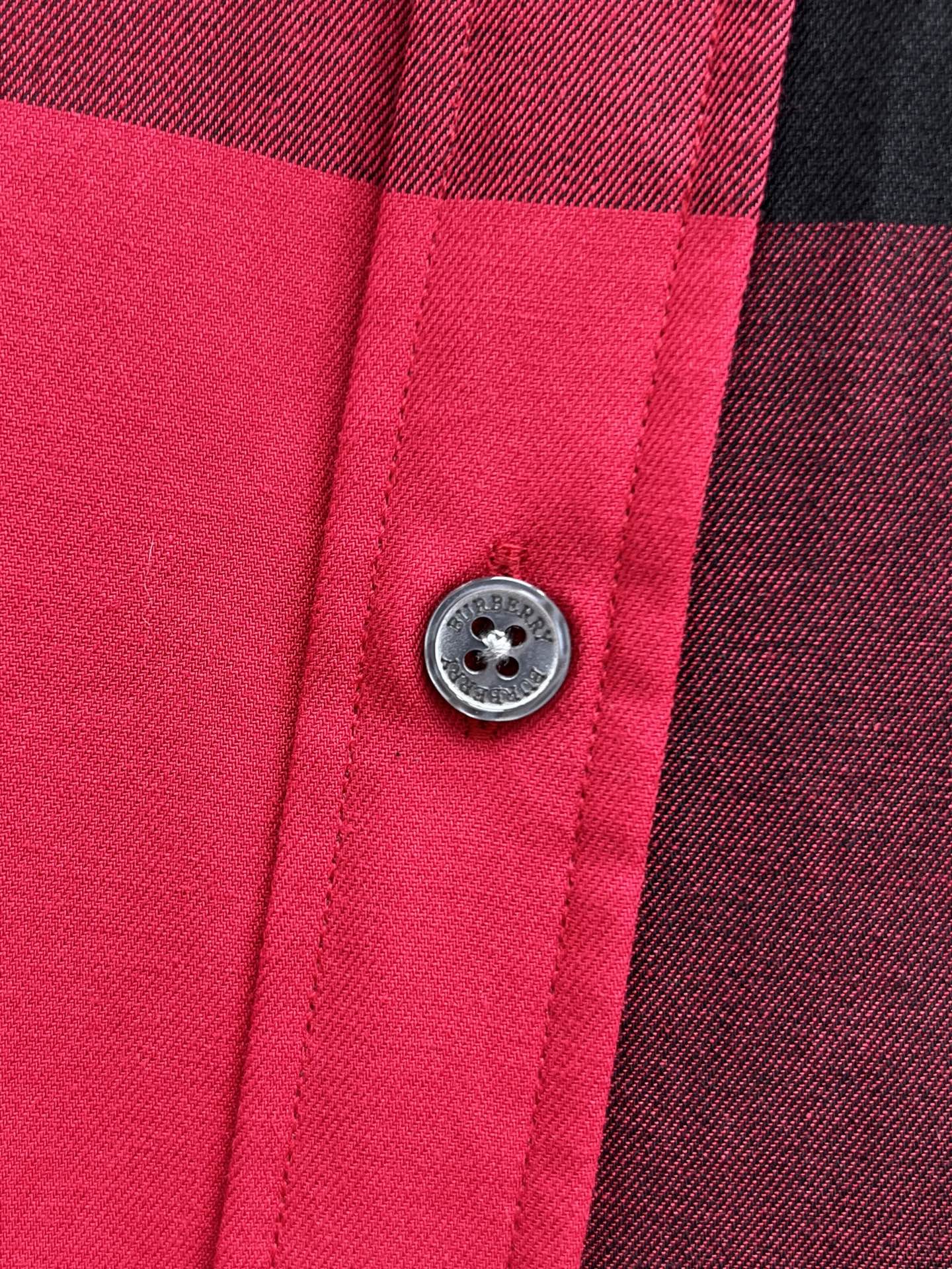 Burberry plaid shirt close-up of round button and seams