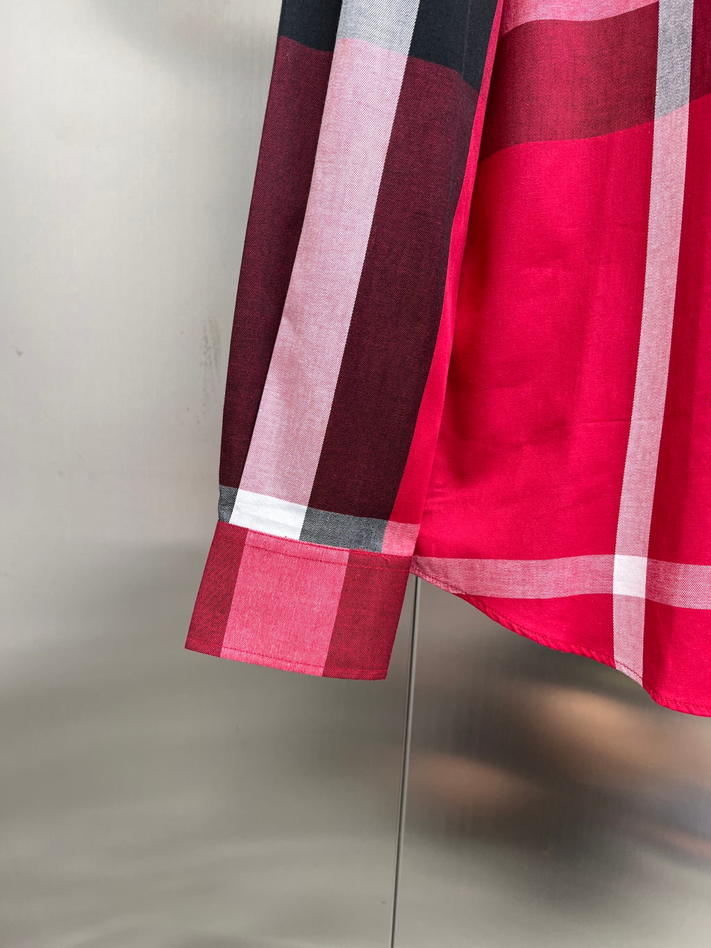 Burberry plaid shirt cuff and sleeve hem with red and dark check blocks