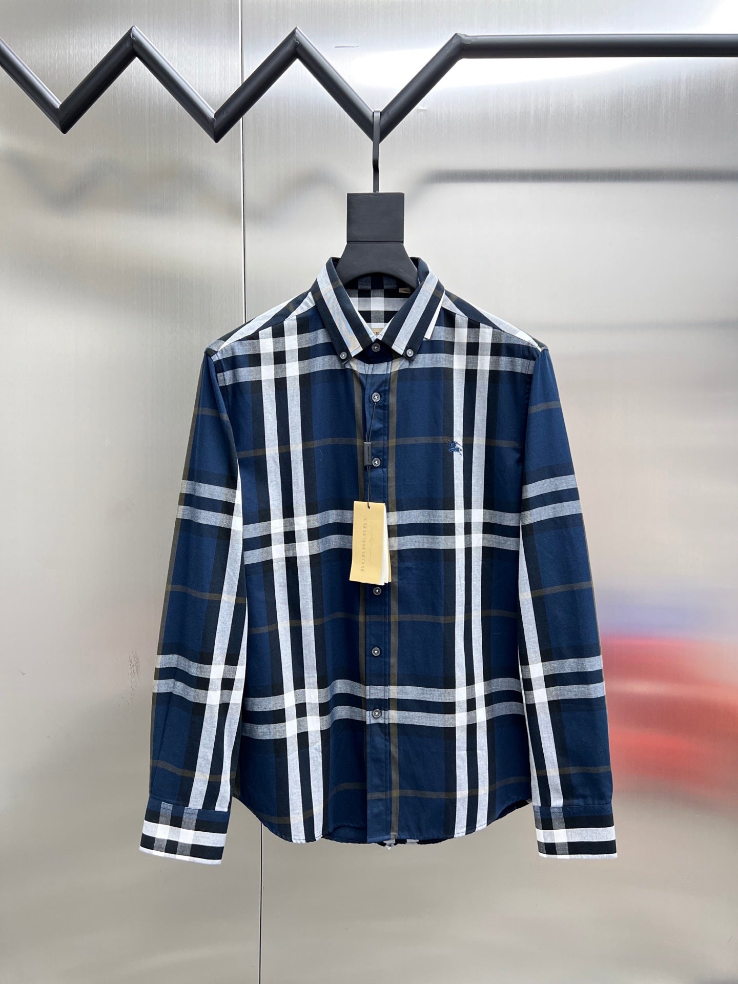 Burberry long-sleeve button-up shirt with blue, white, and dark check pattern