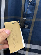 Burberry check shirt with hanging tan tag and buttoned pocket detail