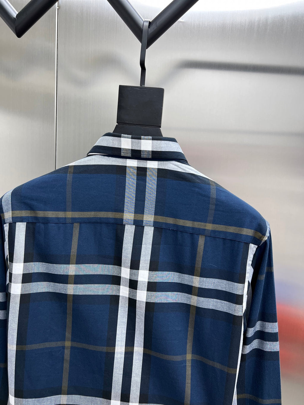 Burberry long-sleeve plaid shirt back view on hanger