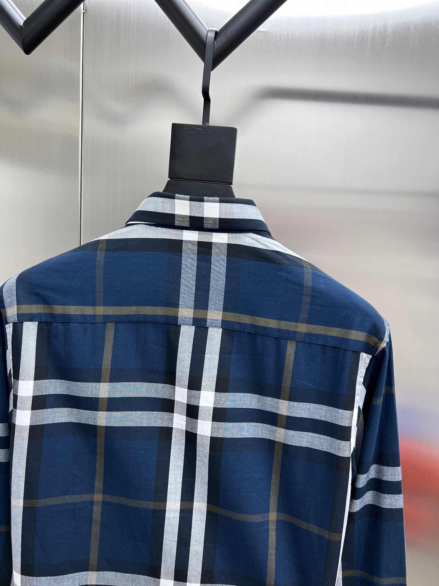 Burberry long-sleeve plaid shirt back view on hanger