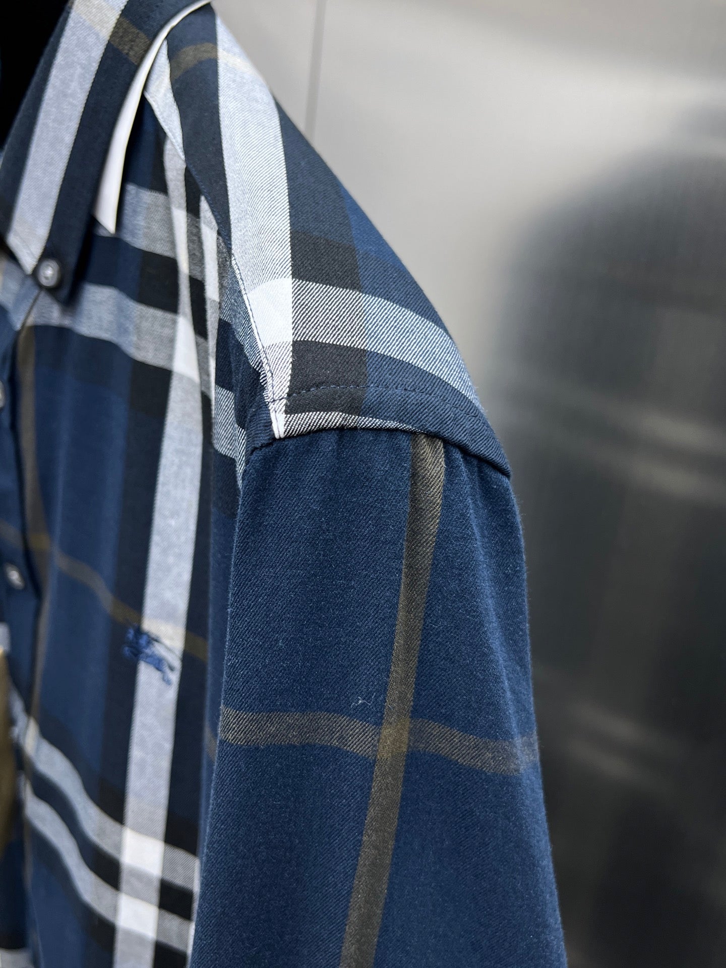 Burberry check shirt sleeve with blue base and white plaid stripes