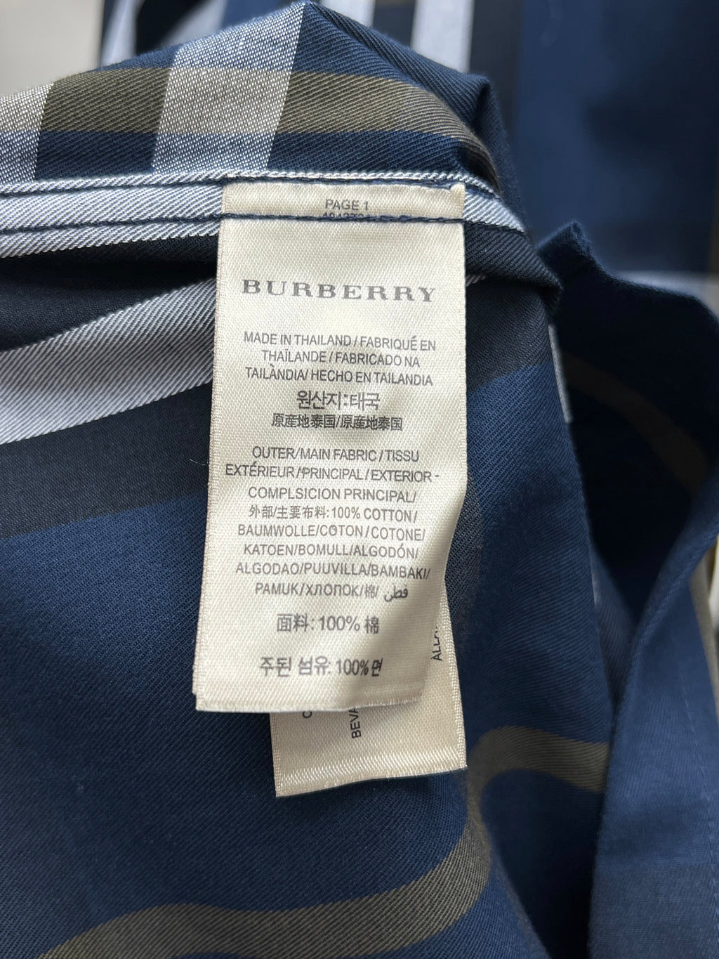 Burberry plaid shirt inner label with fabric composition details