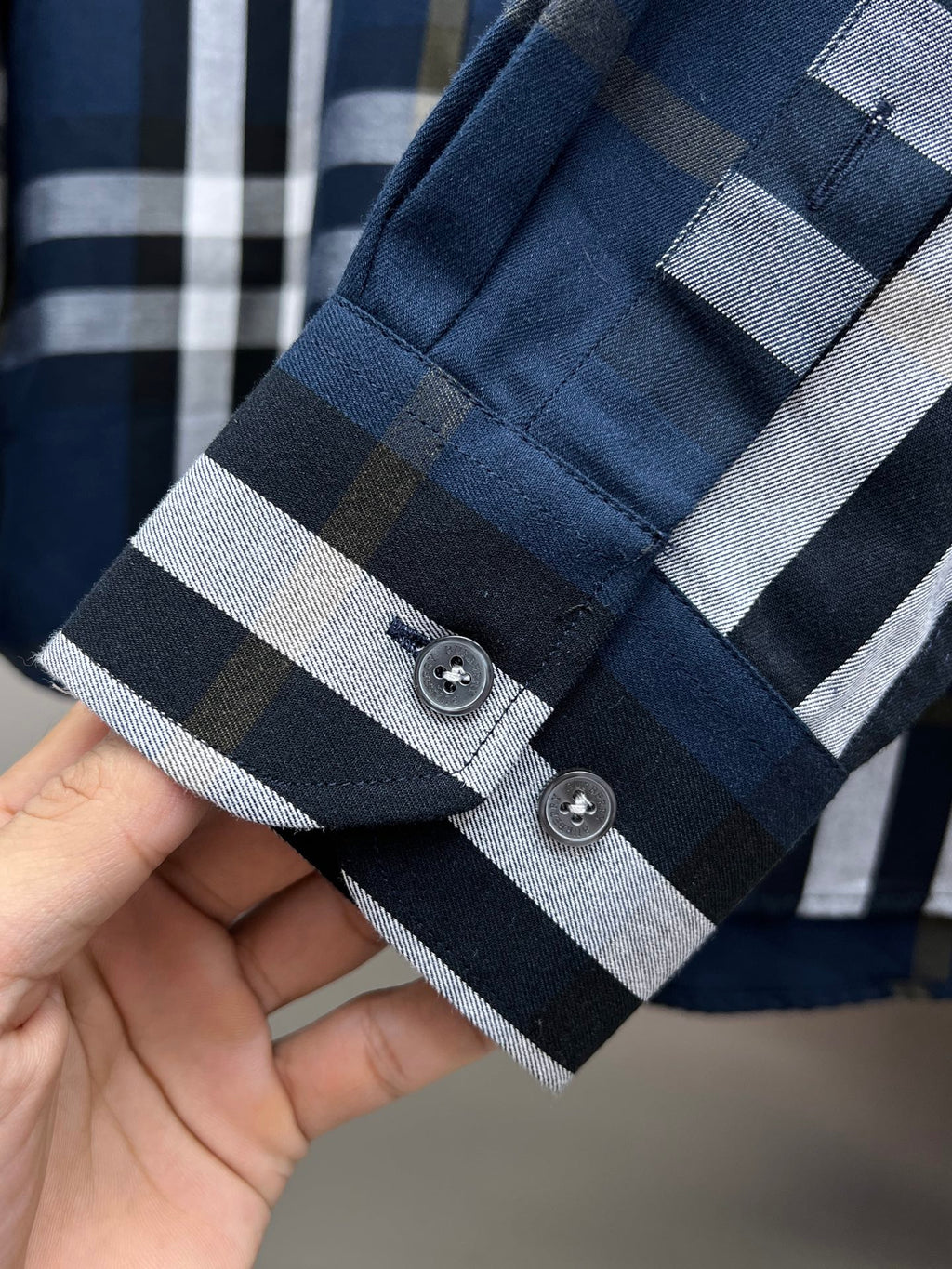 Burberry long-sleeve plaid shirt cuff and placket with two buttons
