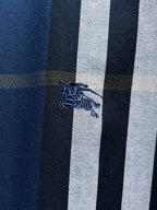 Close-up of Burberry blue, white, and dark check fabric