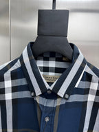 Burberry check shirt collar and placket with round buttons; fabric weave visible