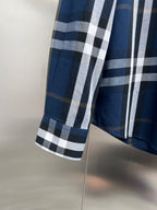 Burberry check button-up shirt side view with blue and white plaid