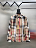 Plaid long-sleeve button-up shirt on hanger, beige with black and red stripes