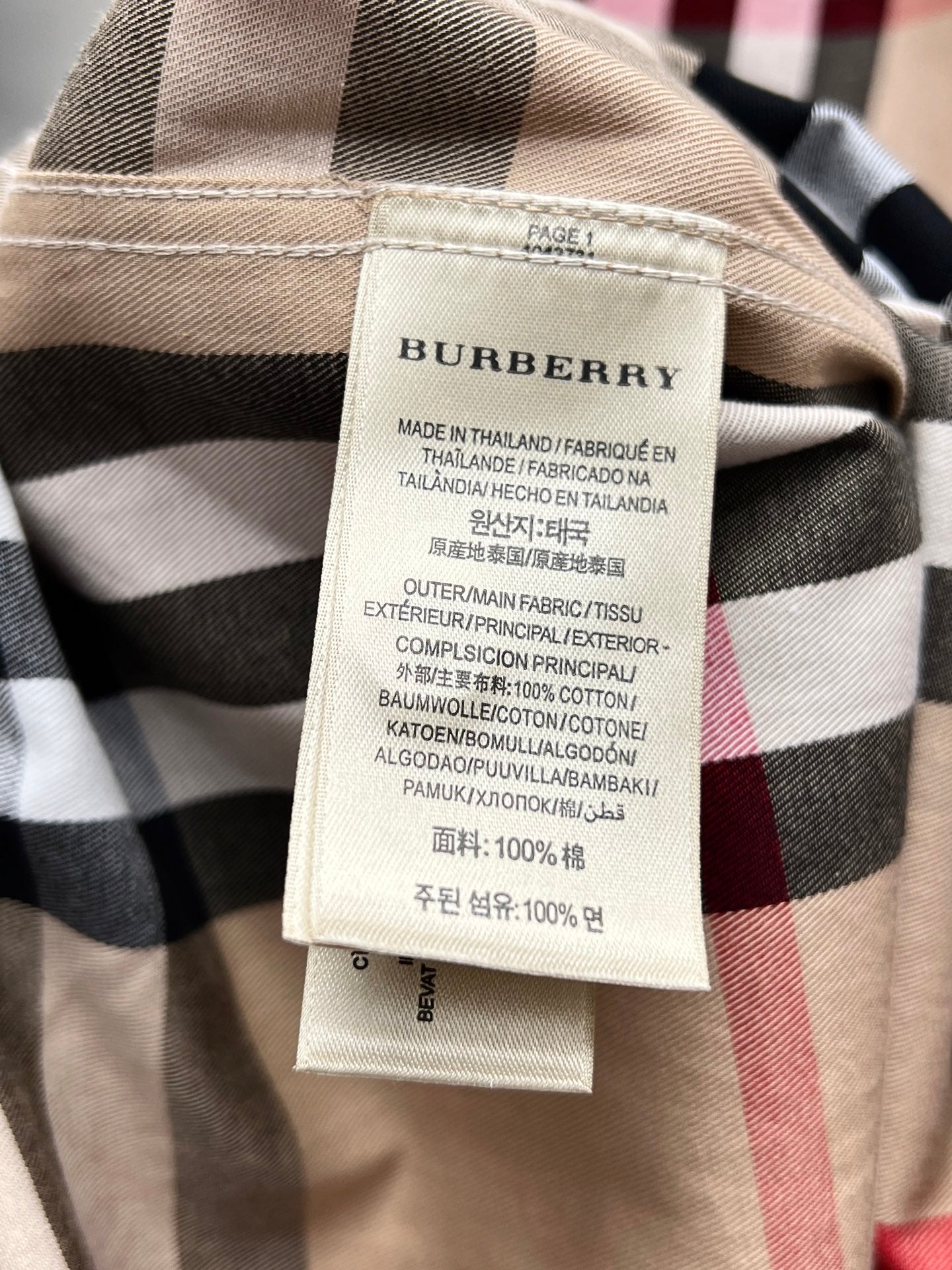 Burberry plaid shirt care label and fabric composition tag