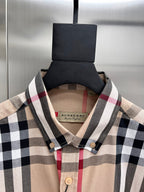 Plaid shirt neckline and buttons, beige fabric with black and red check pattern