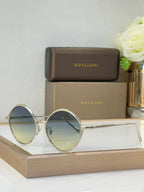 Silver round sunglasses with light gradient lenses and thin metal arms