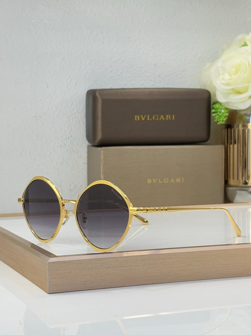 Gold round eyeglasses with dark tinted lenses and slim metal temples
