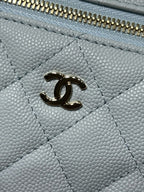 Light blue quilted leather handbag with gold Chanel CC logo and zipper teeth