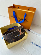 Louis Vuitton monogram belt with gold-tone LV buckle, dark brown leather.