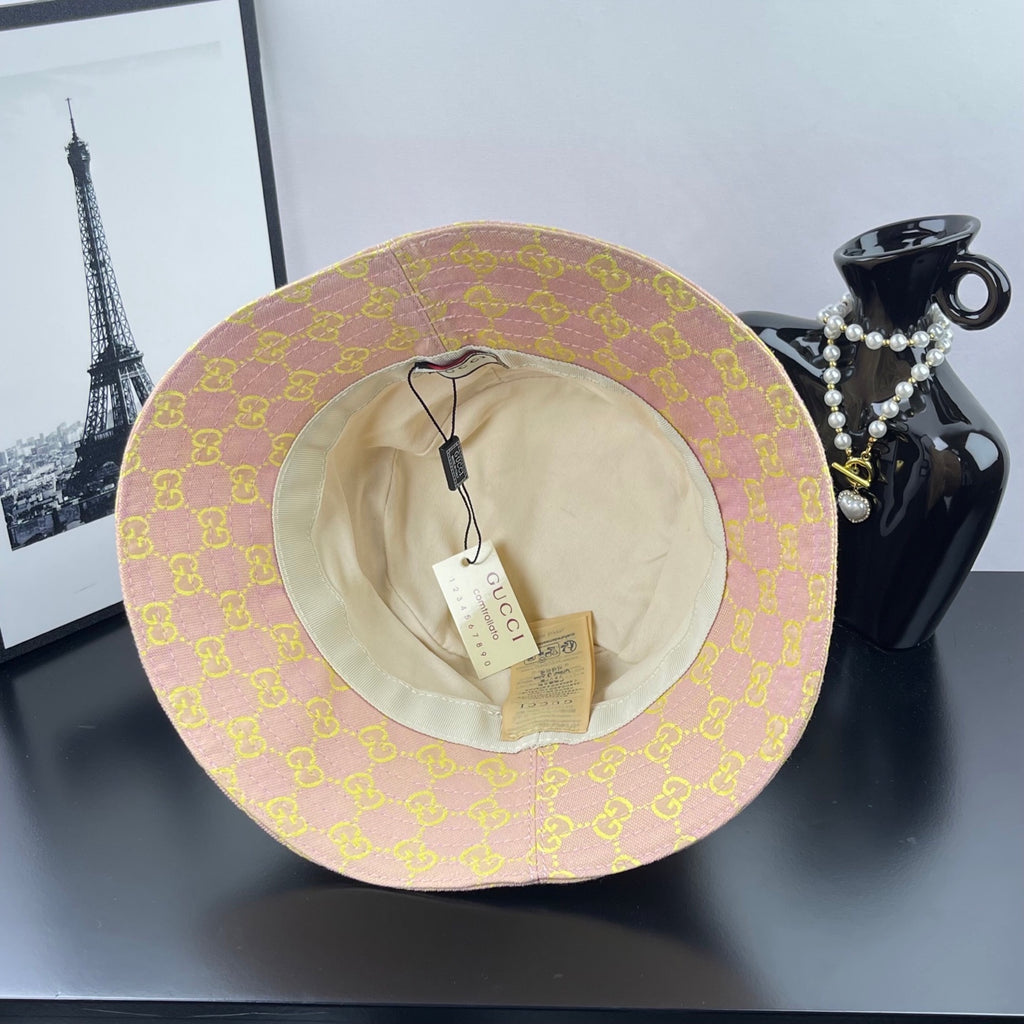 Light purple GG logo bucket hat with beige interior lining visible