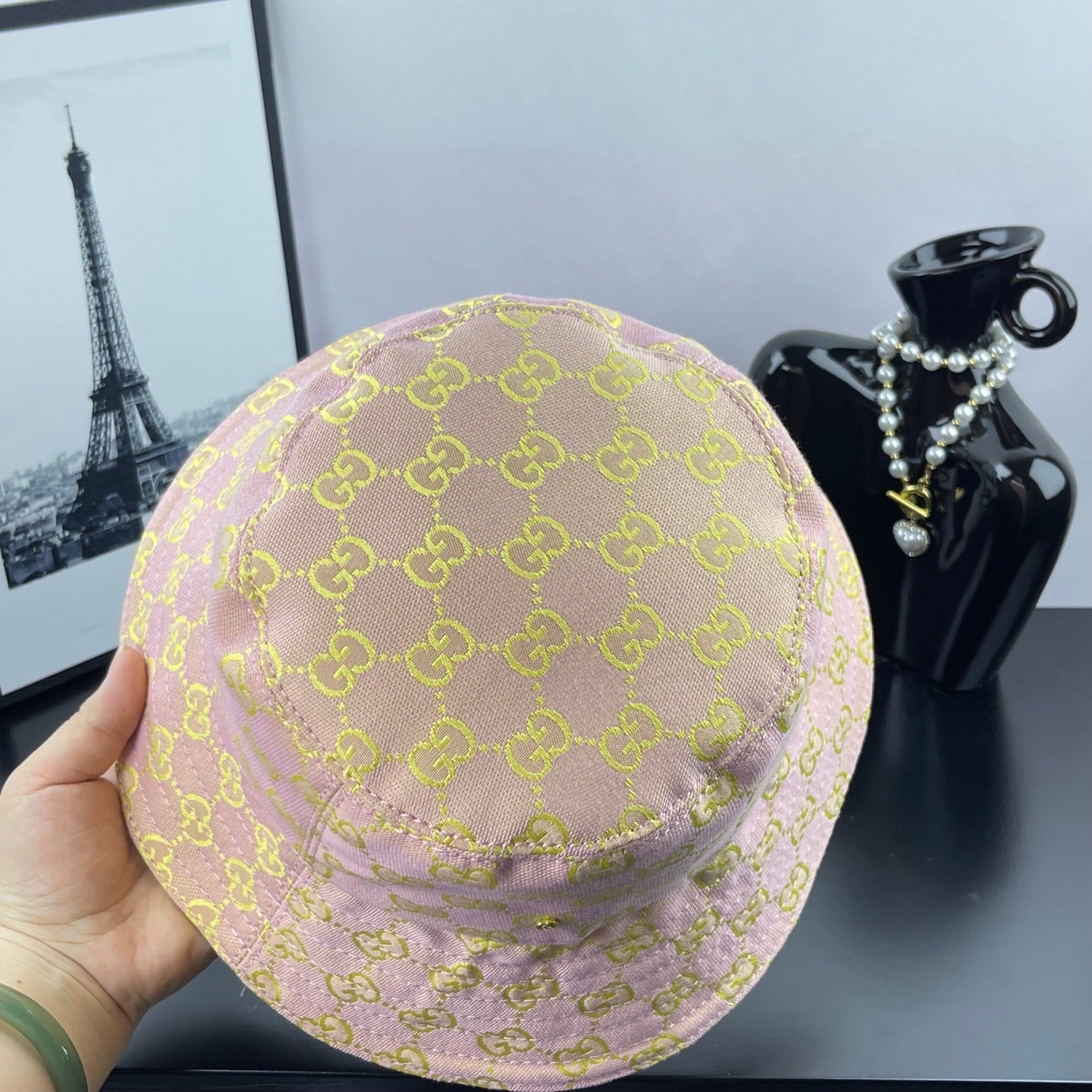 Light purple GG logo bucket hat from the back, visible crown stitching