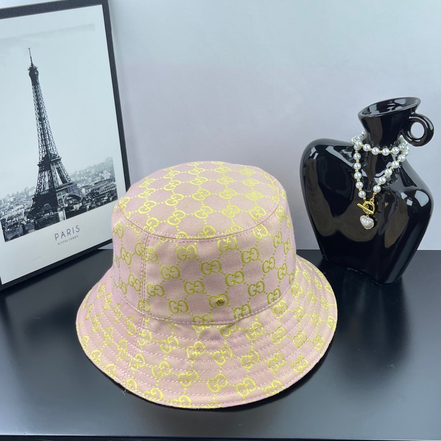 Light purple GG logo bucket hat with stitched brim and patterned crown