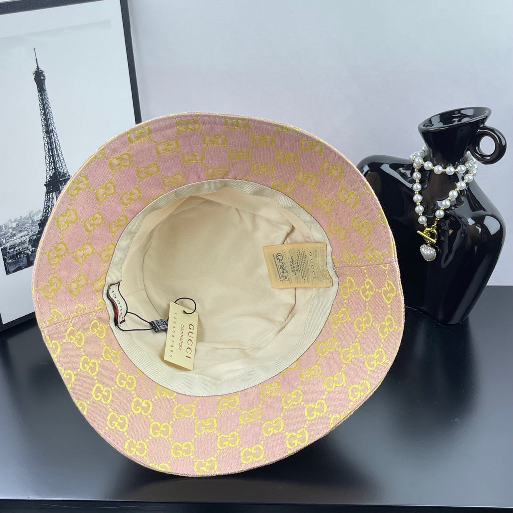Light purple GG logo bucket hat interior view with beige lining and tags