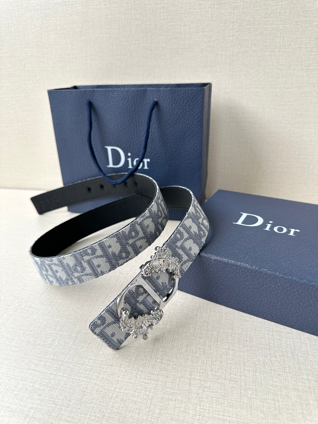 Belt set: black leather strap plus blue-gray logo jacquard strap with ornate buckle
