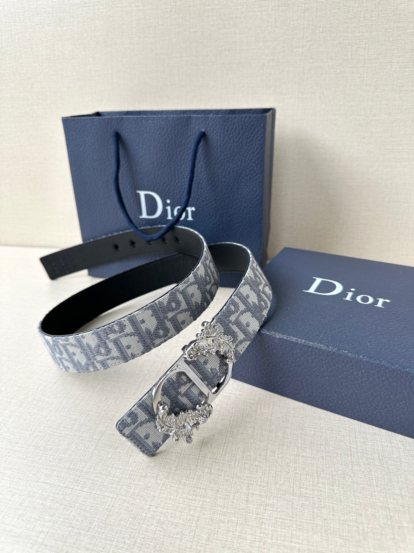 Belt set: black leather strap plus blue-gray logo jacquard strap with ornate buckle