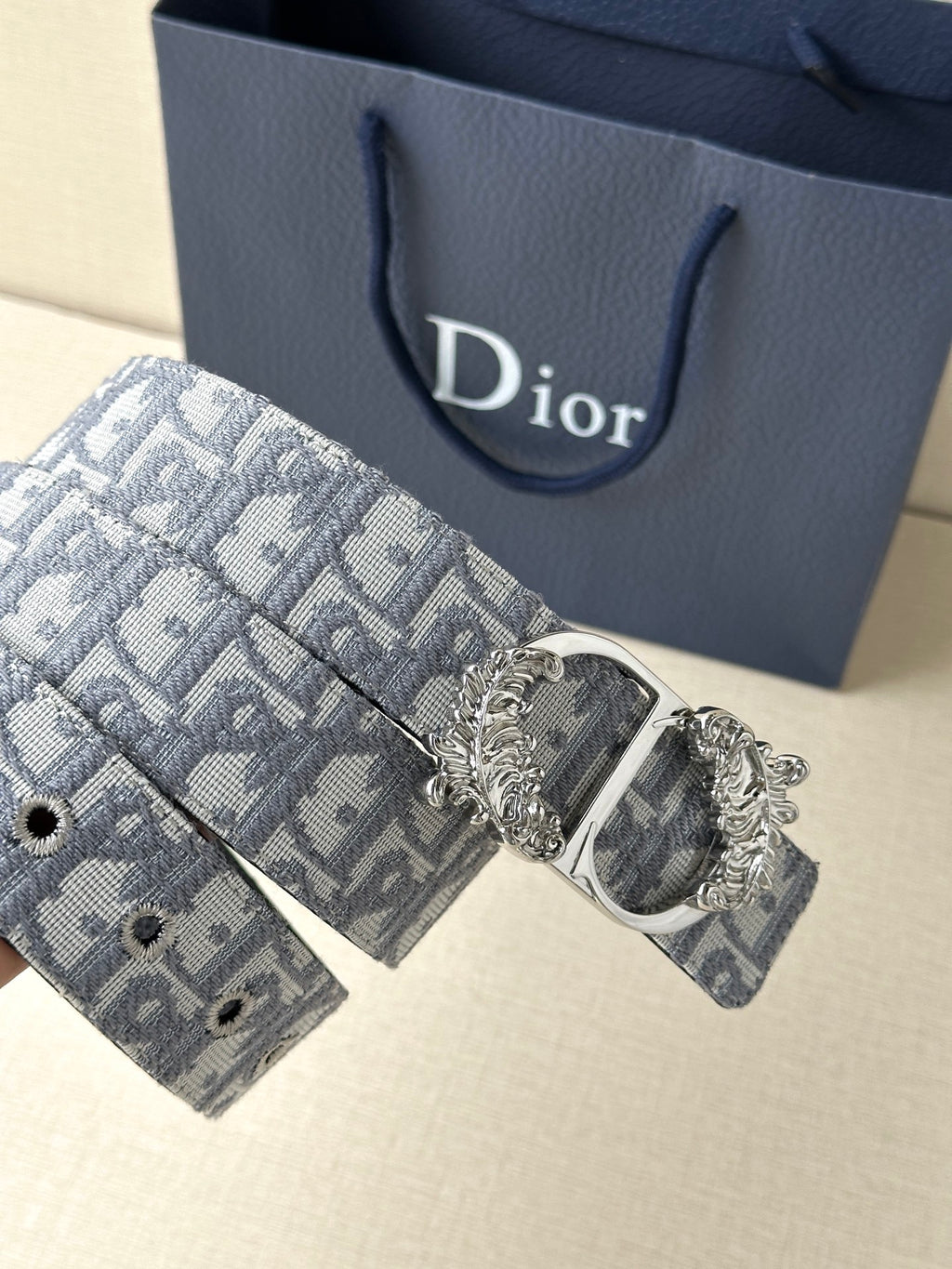 Blue-gray logo jacquard belt with ornate silver buckle