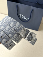 Blue-gray logo jacquard belt with ornate silver buckle