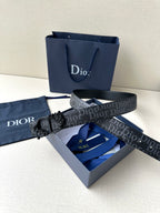 Dior belt with dark monogram strap and black floral-style buckle