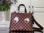 Louis Vuitton Damier checkered tote bag with dark leather handles and shoulder strap