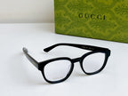 Black Gucci eyeglasses angled view with logo on temple and clear lenses