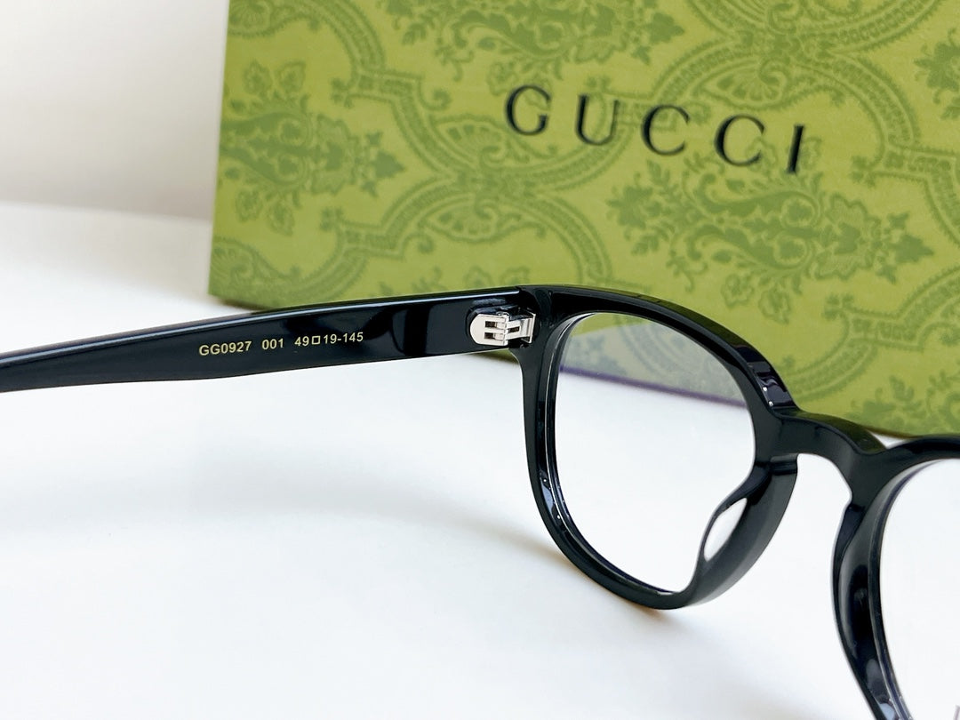 Black Gucci eyeglasses close-up of hinge and temple with clear lenses
