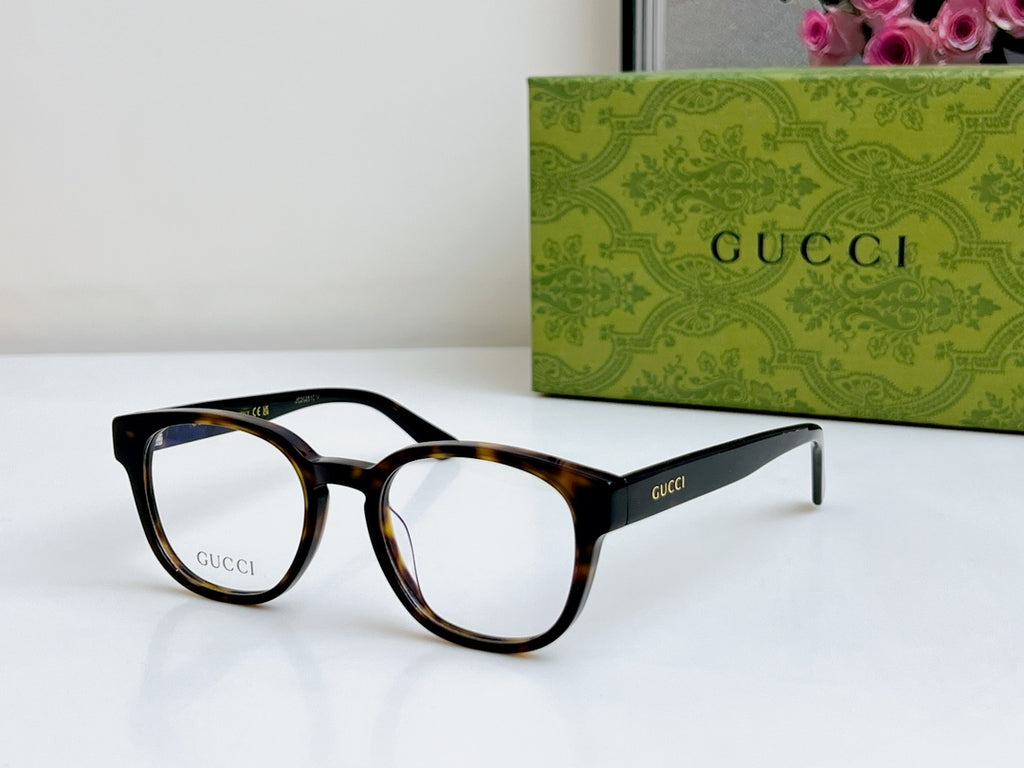 Gucci eyeglasses side-angled front view with black tortoiseshell frame and clear lenses