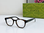 Gucci eyeglasses side-angled front view with black tortoiseshell frame and clear lenses