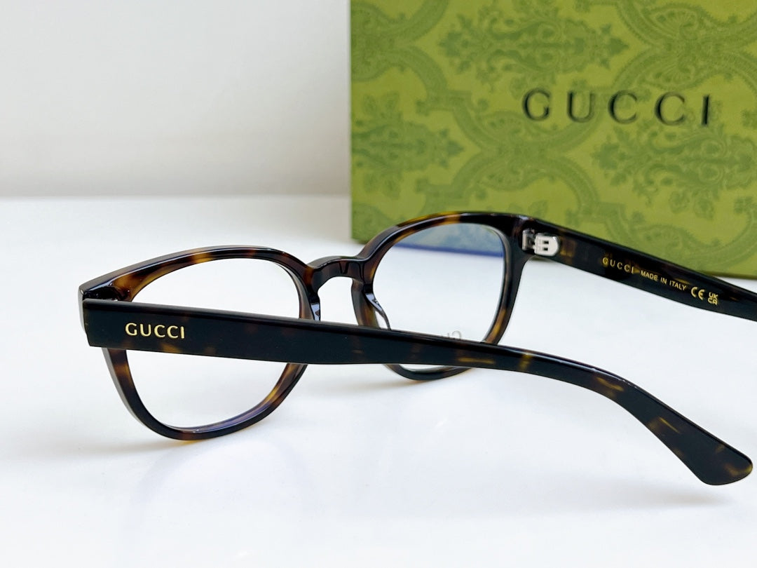 Gucci eyeglasses angled view with blue-tinted lenses and tortoiseshell temples