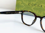 Gucci eyeglasses close-up of black temple with model text and tortoiseshell frame