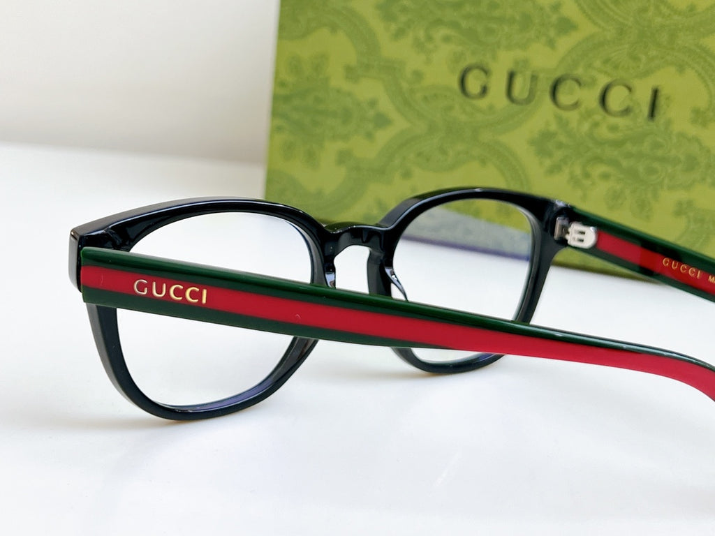 Black Gucci eyeglasses with red-green side stripe on the temple