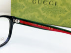 Black Gucci eyeglasses temple with red stripe and Made in Italy text