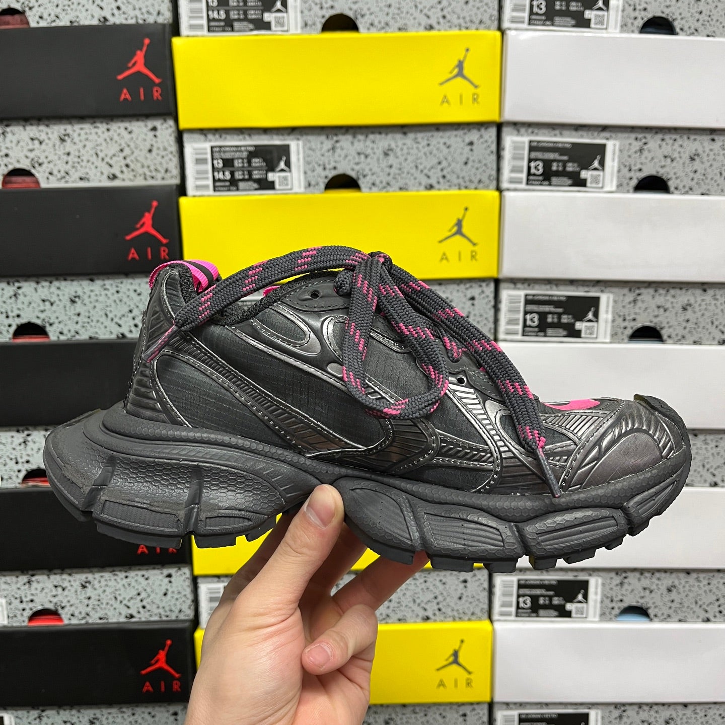 Balenciaga dark gray sneaker profile with pink laces and chunky platform sole