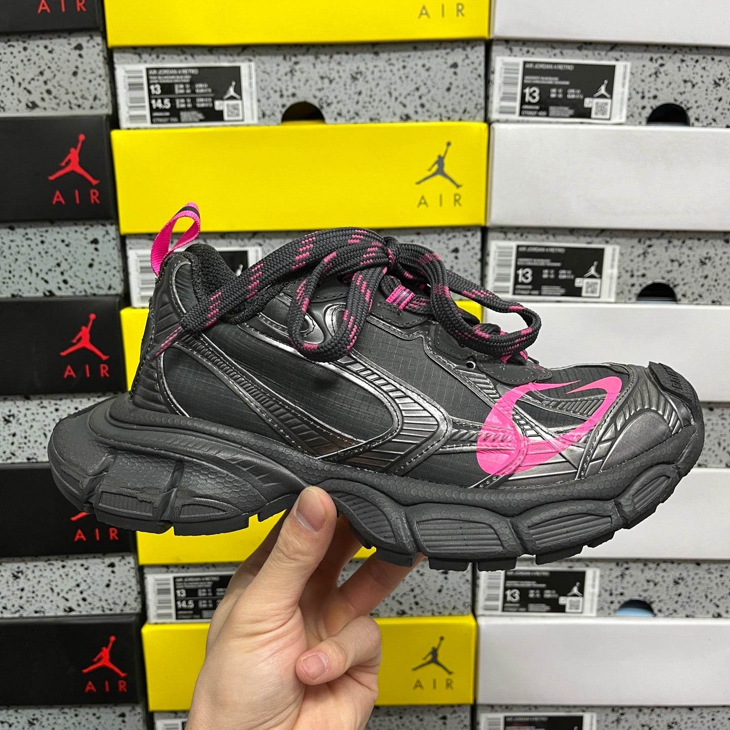 Balenciaga dark gray sneaker with pink laces, molded straps, and chunky sole