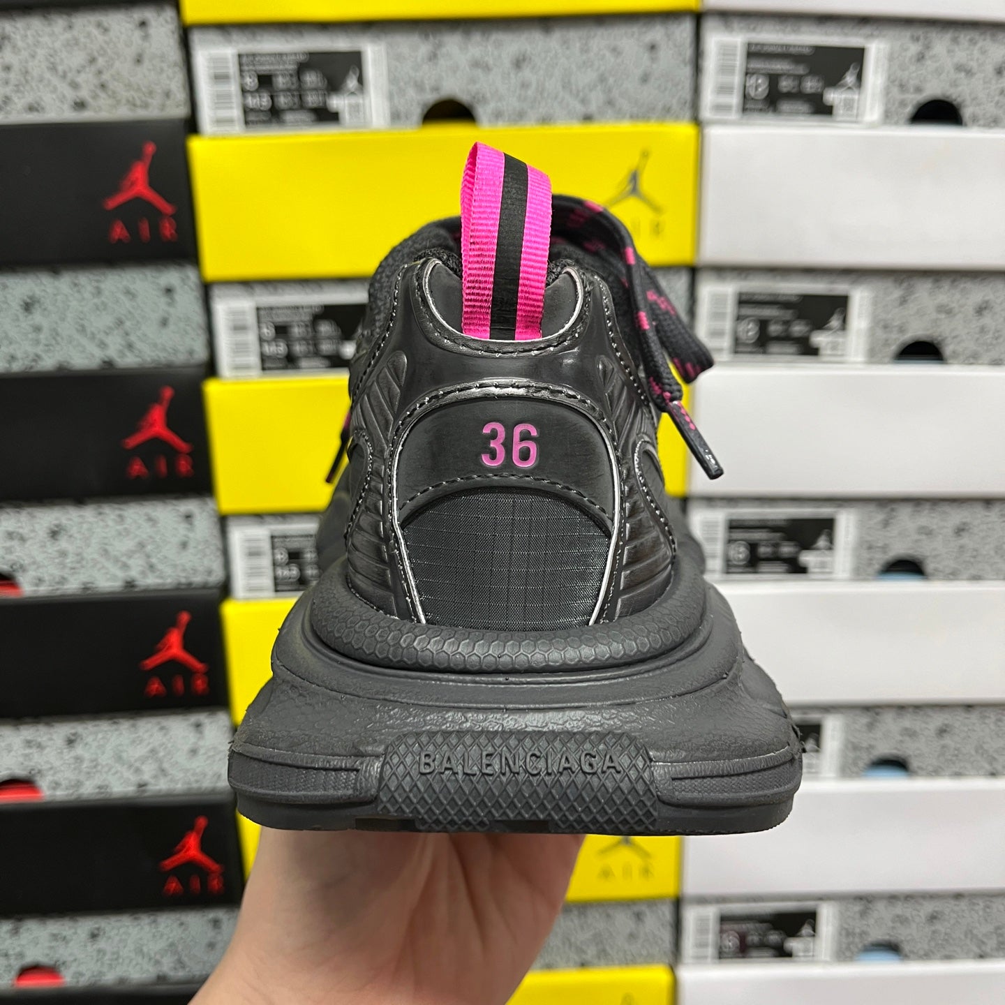Balenciaga dark gray sneaker back view with pink heel tab and size 36 marking