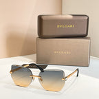 Bvlgari eyeglasses, light blue lenses, gold-tone frame, black temples.