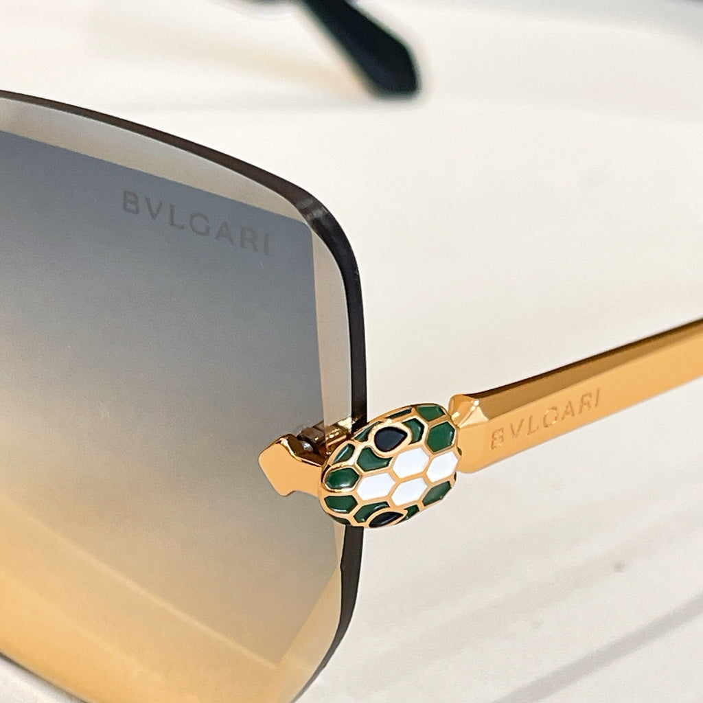 Bvlgari eyeglasses close-up, gold-tone temple with patterned detail, black frame.