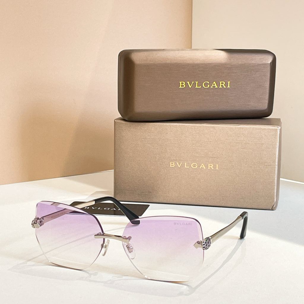 Bvlgari eyeglasses, purple gradient lenses, gold-tone frame, black temples.