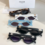 Assorted cat-eye sunglasses in white, blue, tortoiseshell, and black frames