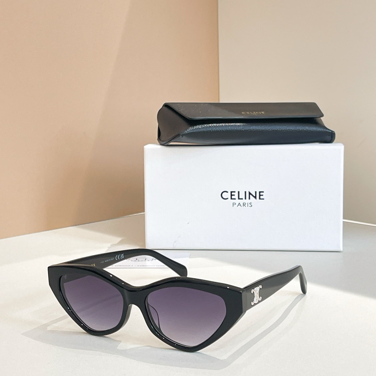 Celine cat-eye sunglasses with purple-tinted lenses and black frames