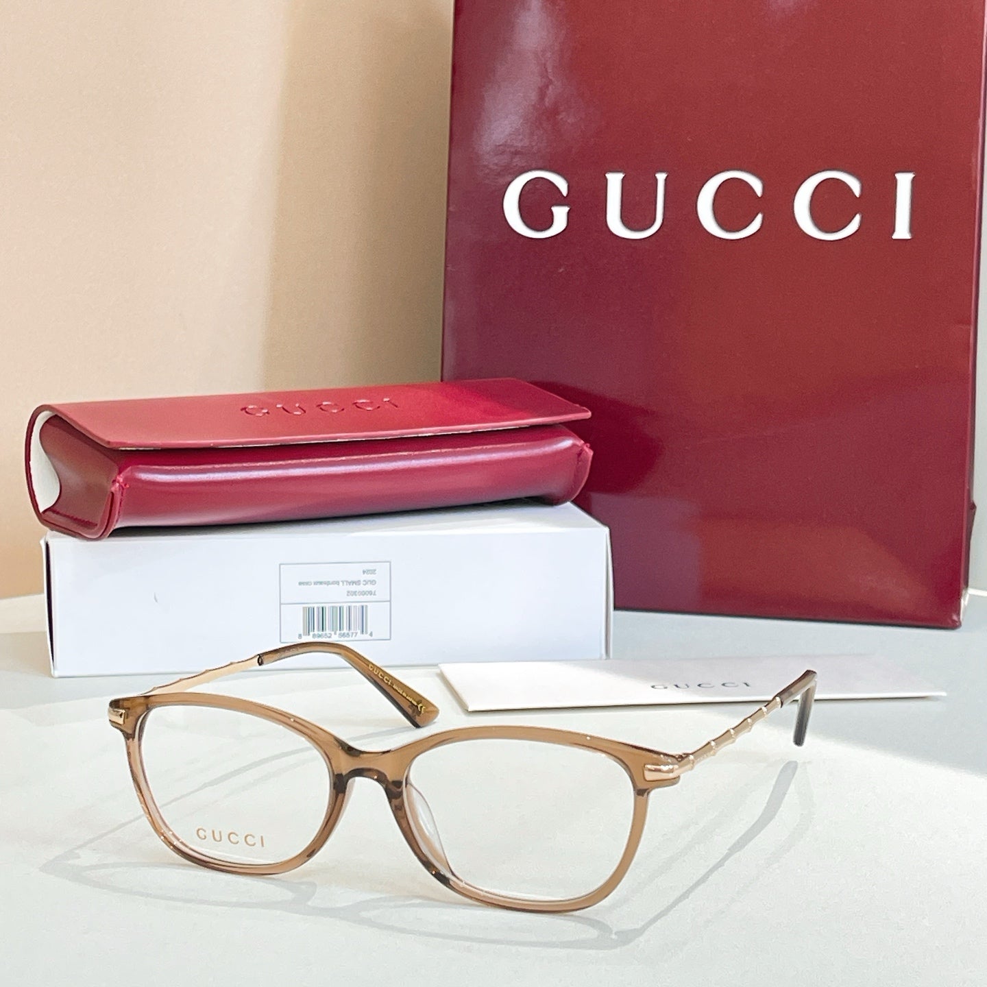 Gucci glasses: tortoise and gold round frames with clear lenses, with red case and box