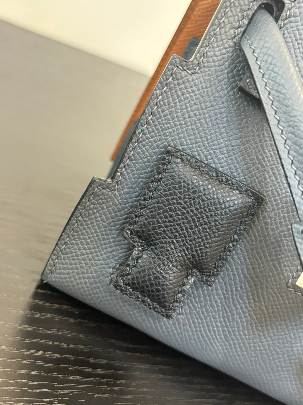 Hermes bag in light blue with textured leather and stitched decorative patch panel.