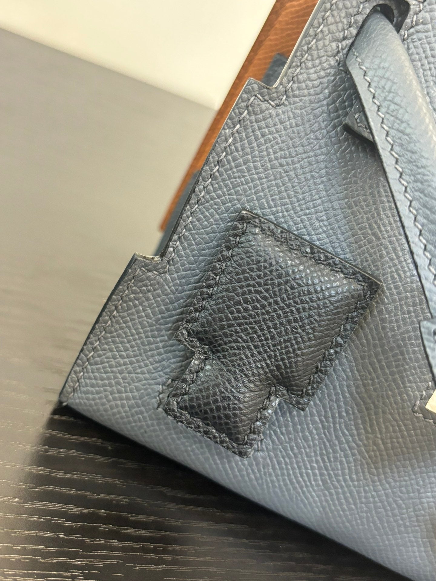 Hermes bag in light blue with textured leather and stitched decorative patch panel.
