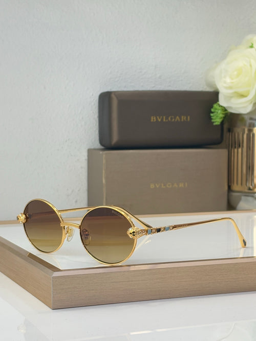 Bvlgari round sunglasses with brown-tinted lenses and gold-tone metal frame, jewel accents