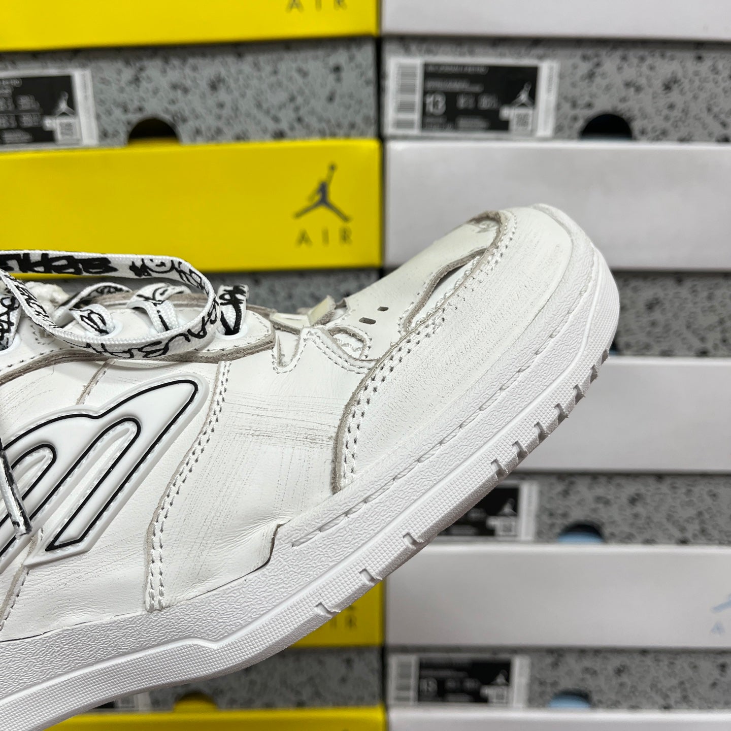 Balenciaga white leather sneaker side paneling with lace and low-profile sole